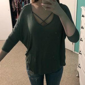 Green lose top with criss cross design at top
